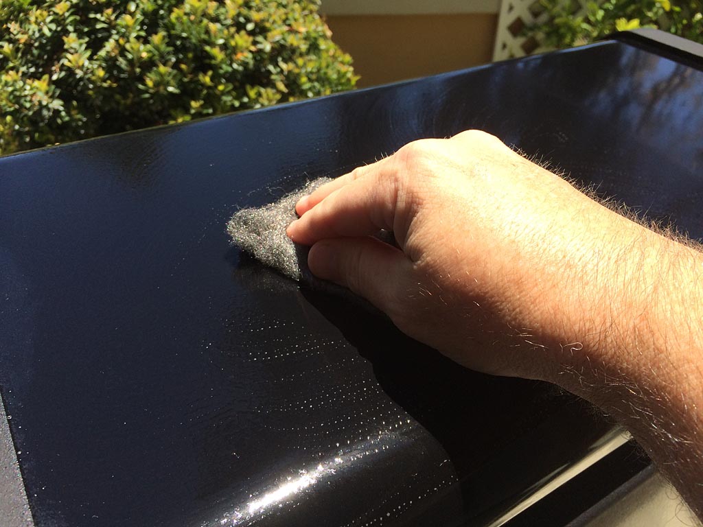 Gently scrubbing surface with 0000 steel wool and Simple Green