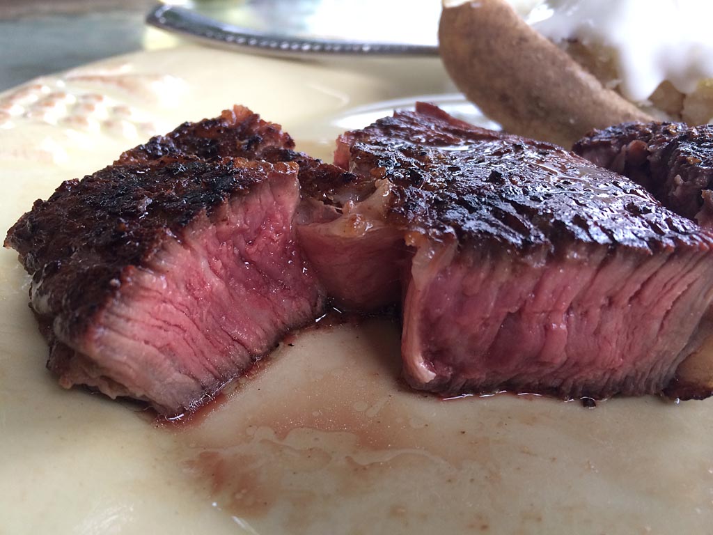 Salted ribeye steak grilled medium rare