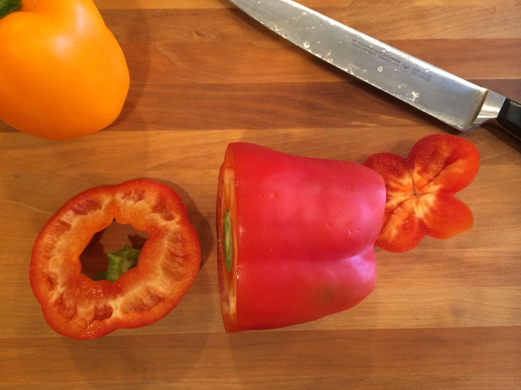 Remove top and bottom of bell pepper