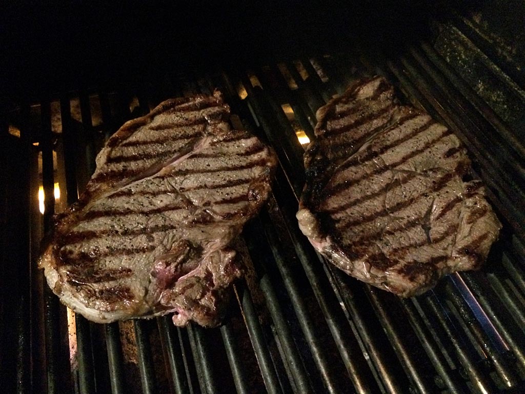 Grilling sirloin steaks over medium heat