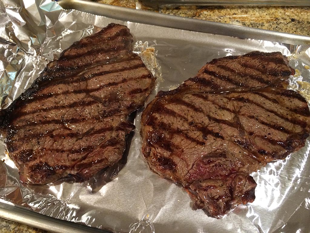 Resting sirloin steaks after grilling