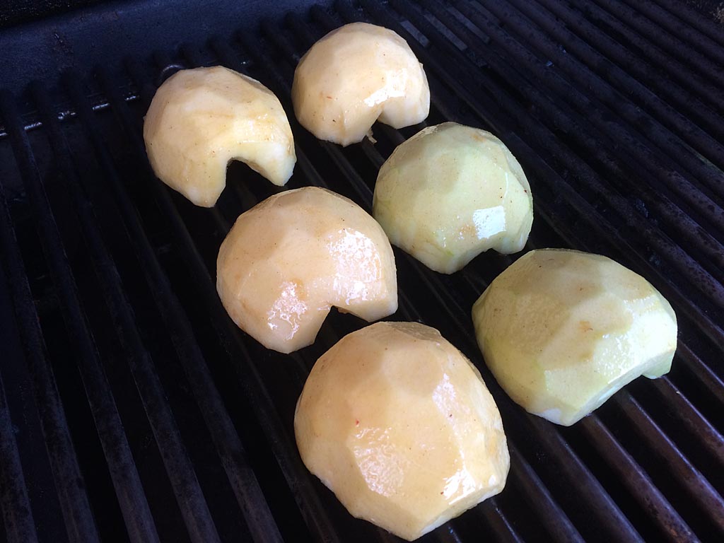 Apples cut-side down on the grill