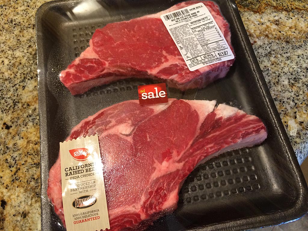 Two bone-in ribeye steaks