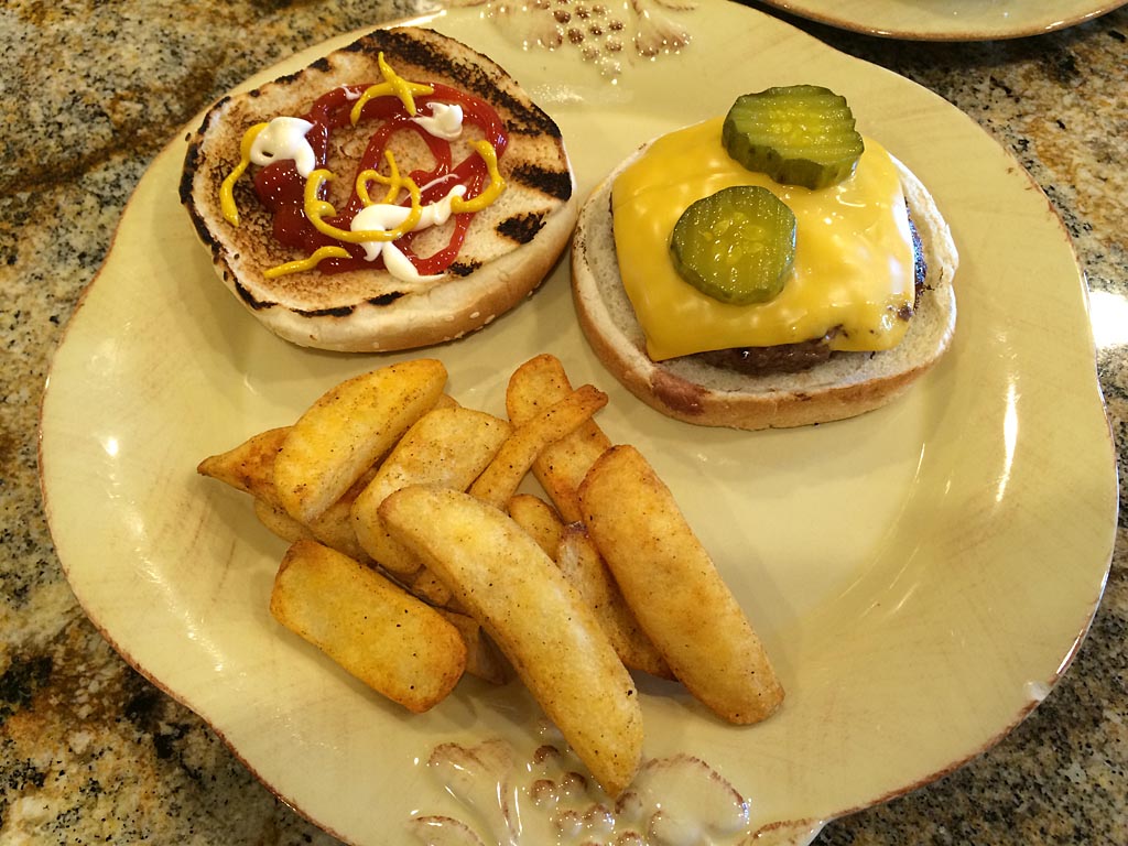 Pressed burger served with steak fries