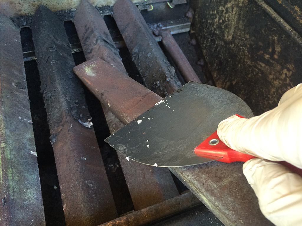 Scraping Flavorizer bars with a wide putty knife