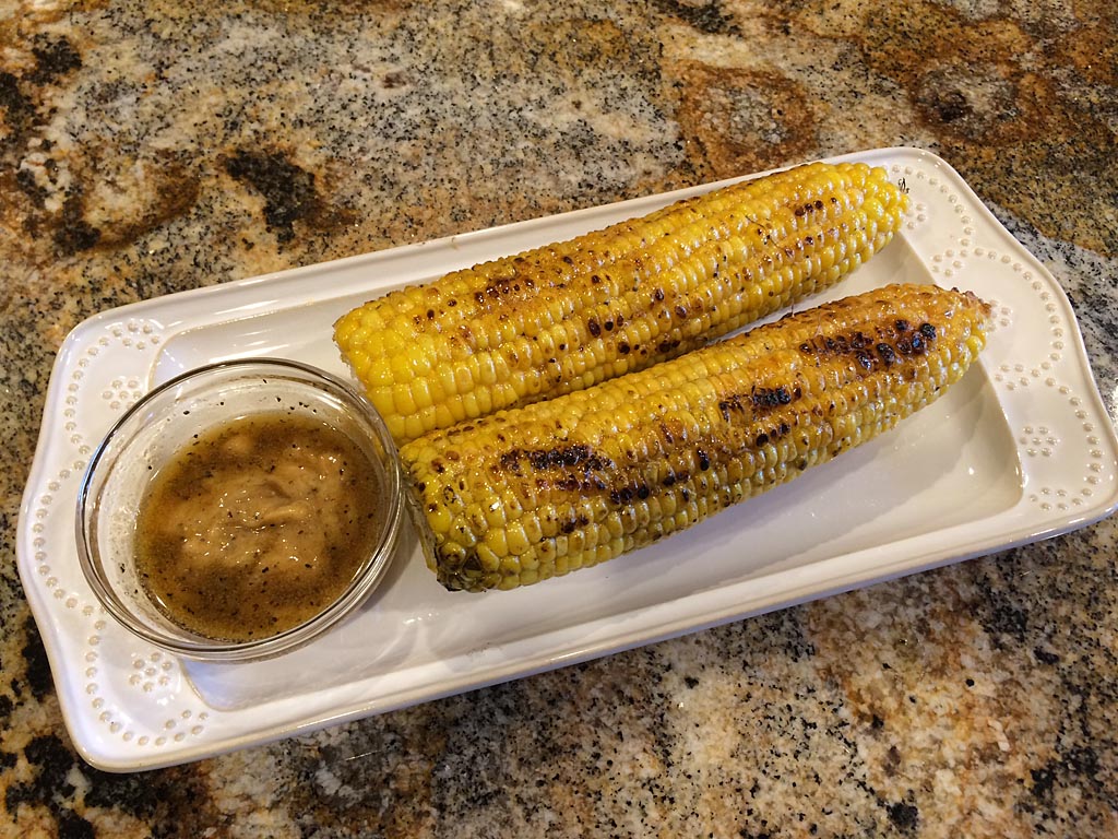 Husk-grilled corn with brown sugar-cayenne butter
