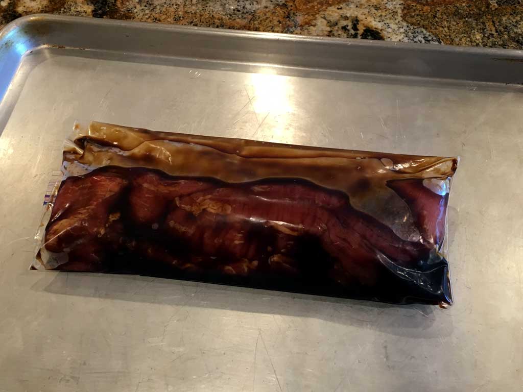 Tenderloin marinating in Ziploc bag