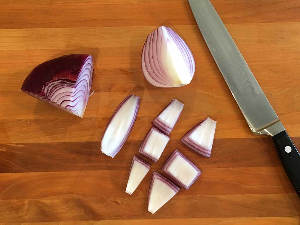 Cutting red onion into pieces