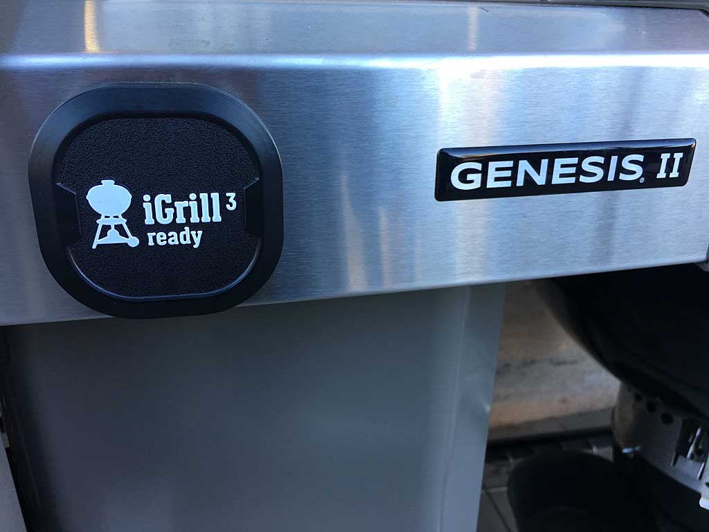 iGrill thermometer holder and Genesis II logo are on the front of the right work surface.
