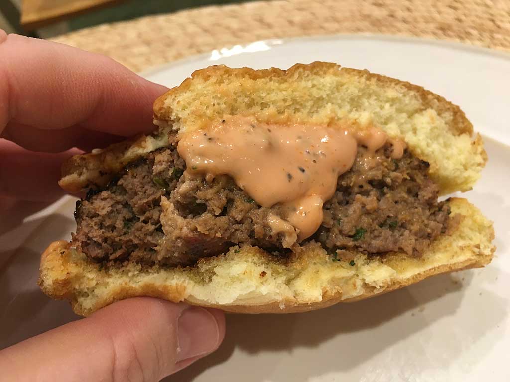 Meatloaf burger with dripping burger sauce
