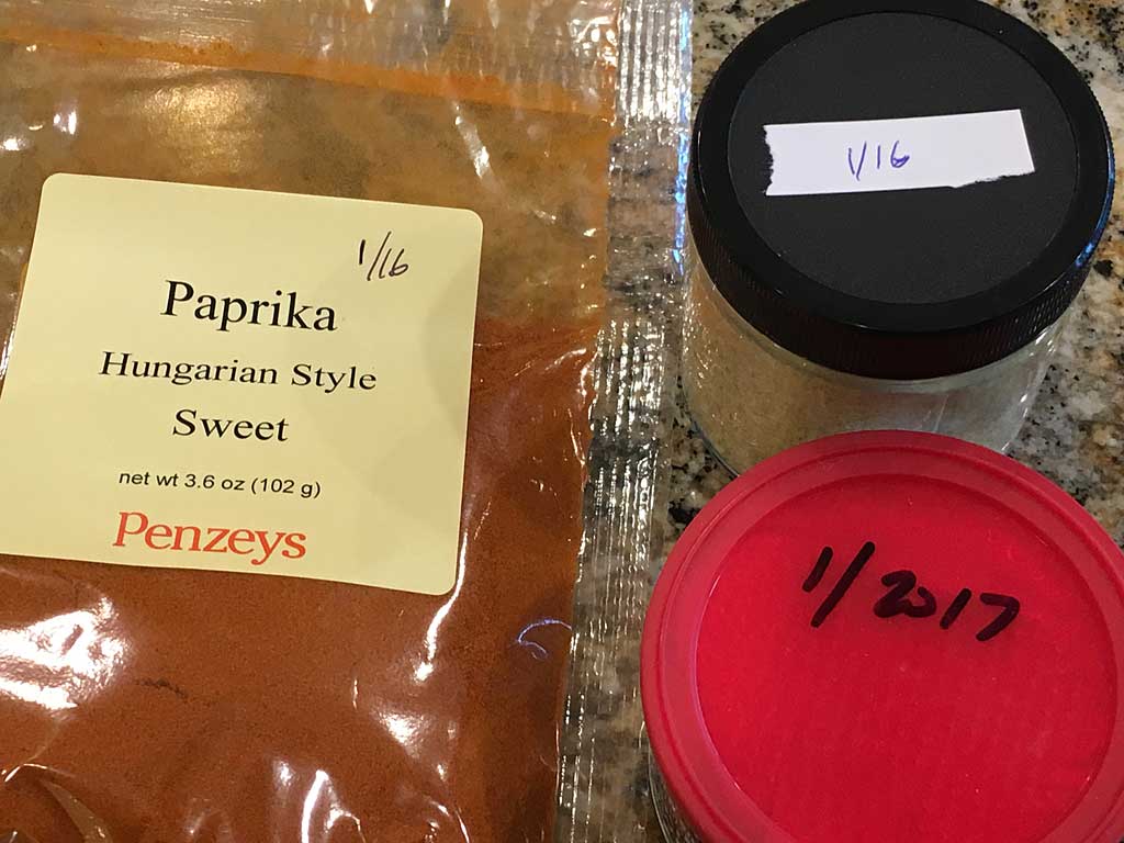 Close-up of labeled spices and pantry ingredients