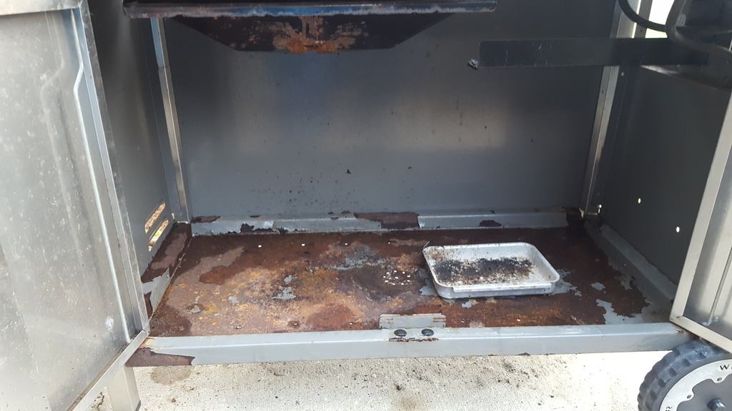 Rusted floorpan in storage enclosure