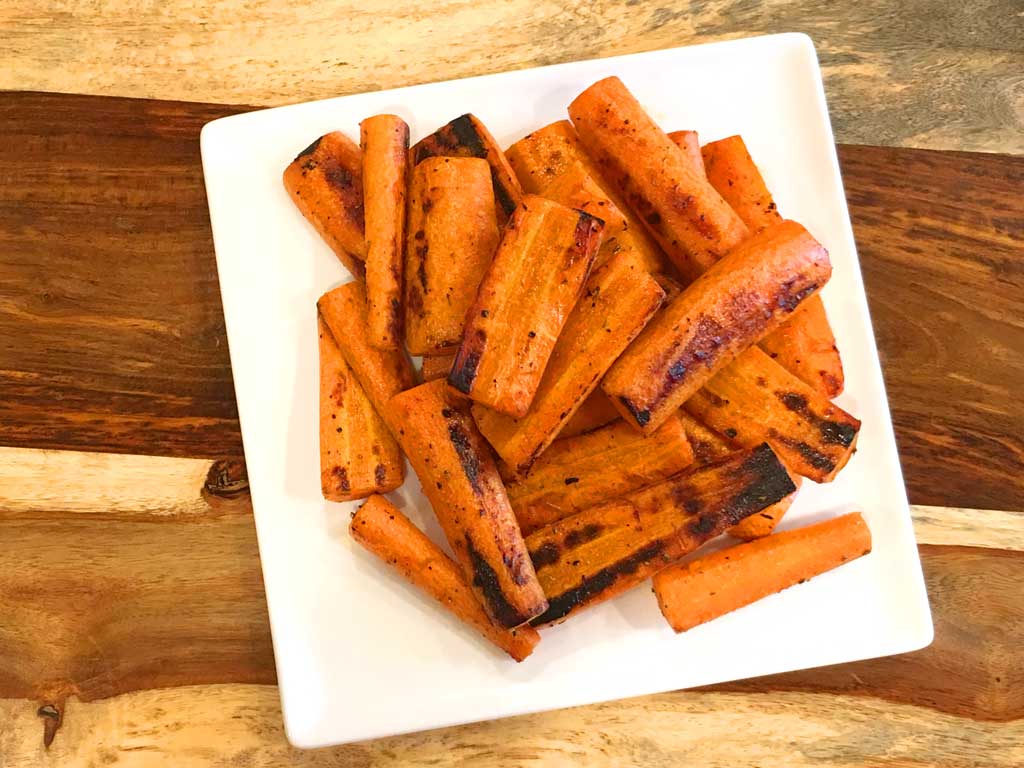 Grilled carrots on serving plate