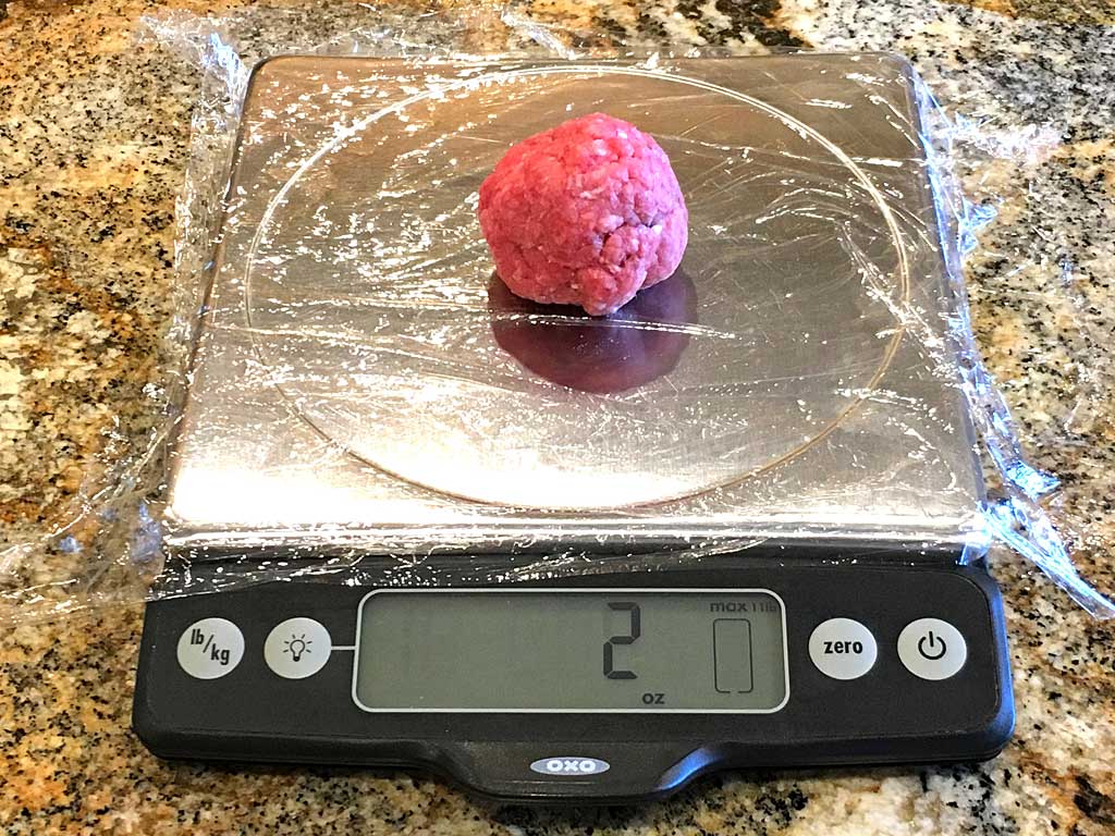 Weighing ground beef on kitchen scale