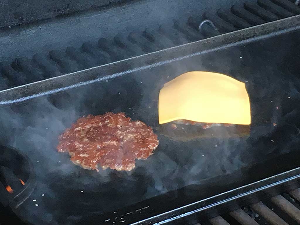 Slice of American cheese on one patty