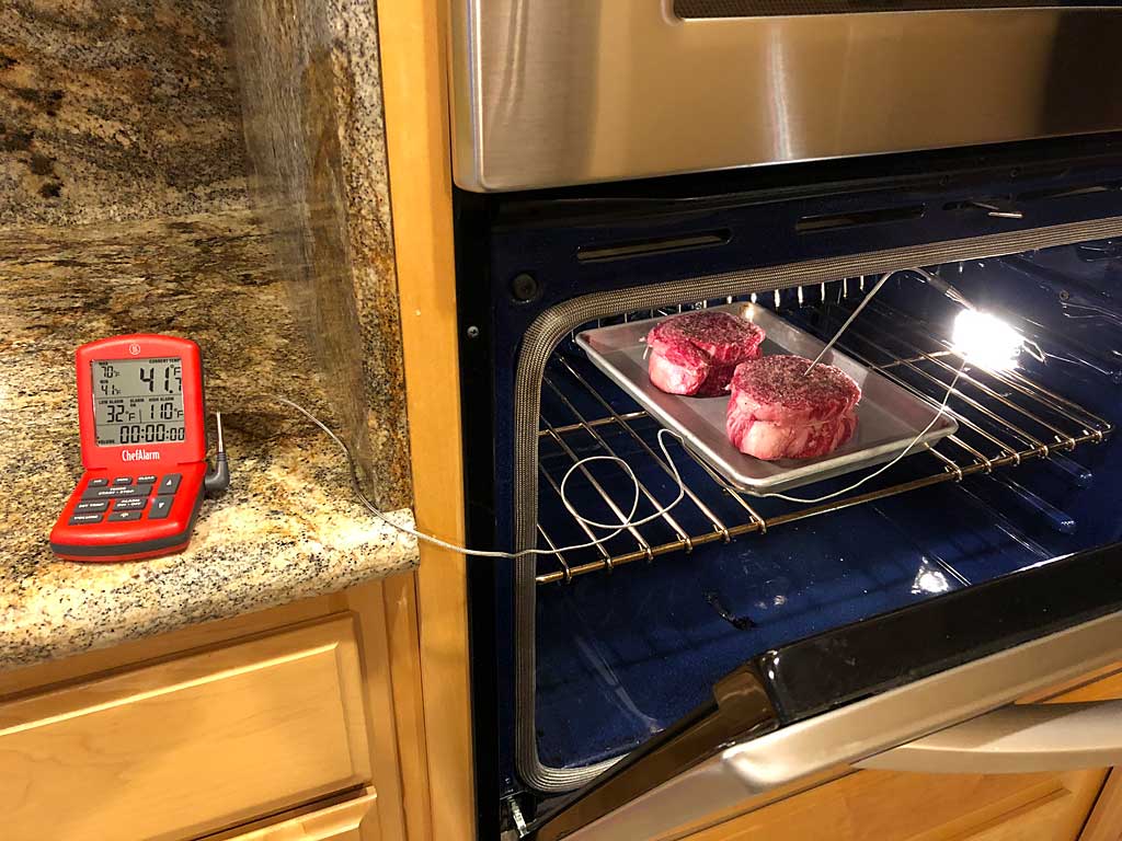 Ribeye steaks go into a 250F oven