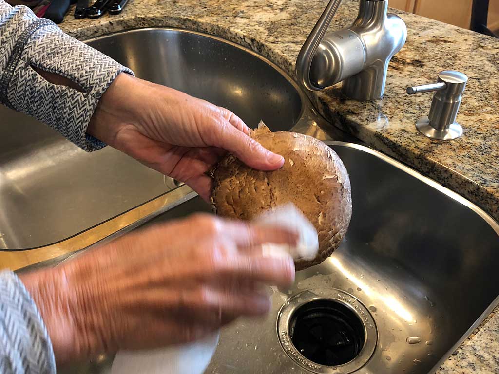 Brushing mushroom caps