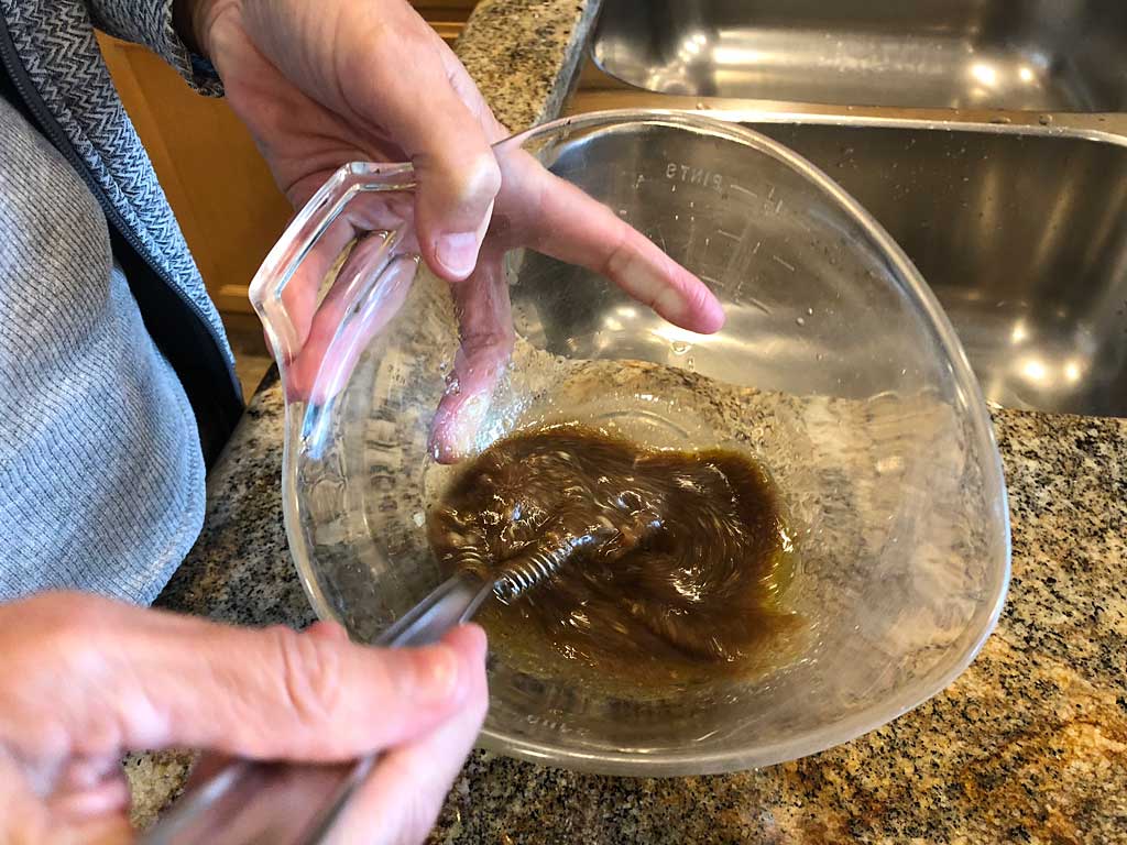 Whisking marinade ingredients until well combined