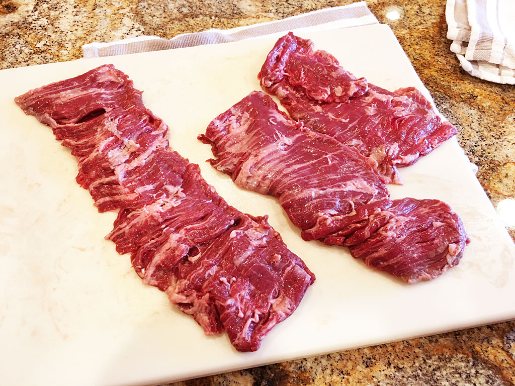 Long skirt steak cut into three pieces