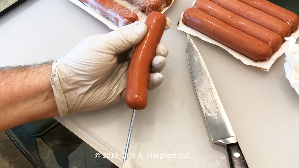 Skewering a hot dog