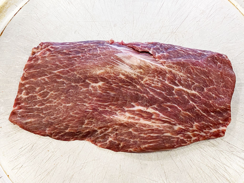Uncooked flat iron steak